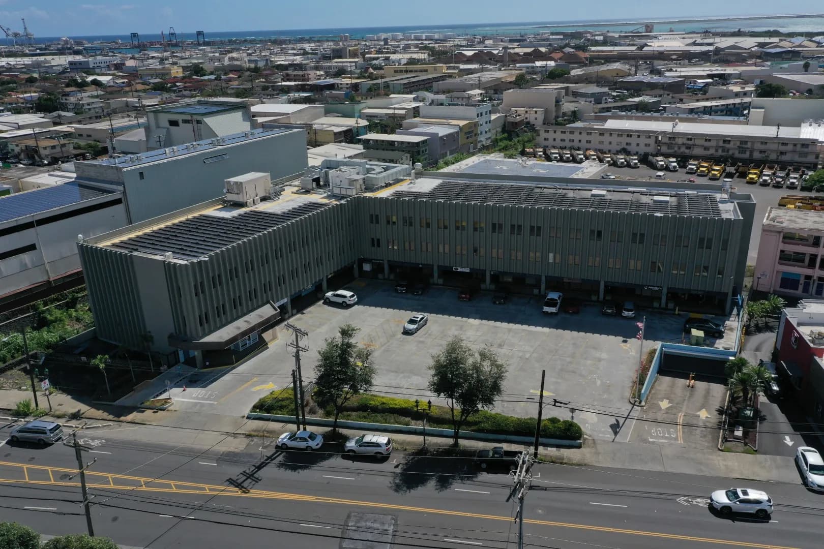 Drone photograph of a multi-story commercial office building in Honolulu